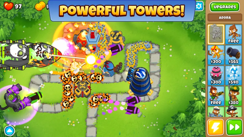 A Bloons TD 6 map with dart monkeys and upgraded towers lining a winding path